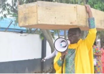 Nigerian Pastor Carries Coffin To Protest Against Buhari Govt